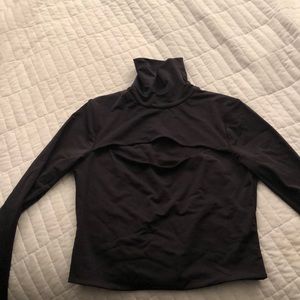 Black turtle neck with slit in the front